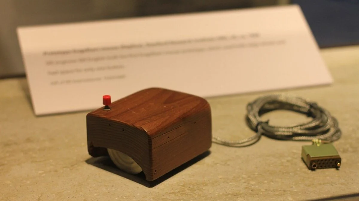 Photo of Douglas Engelbart's prototype computer mouse, a wooden shell with a button, at the Computer History Museum